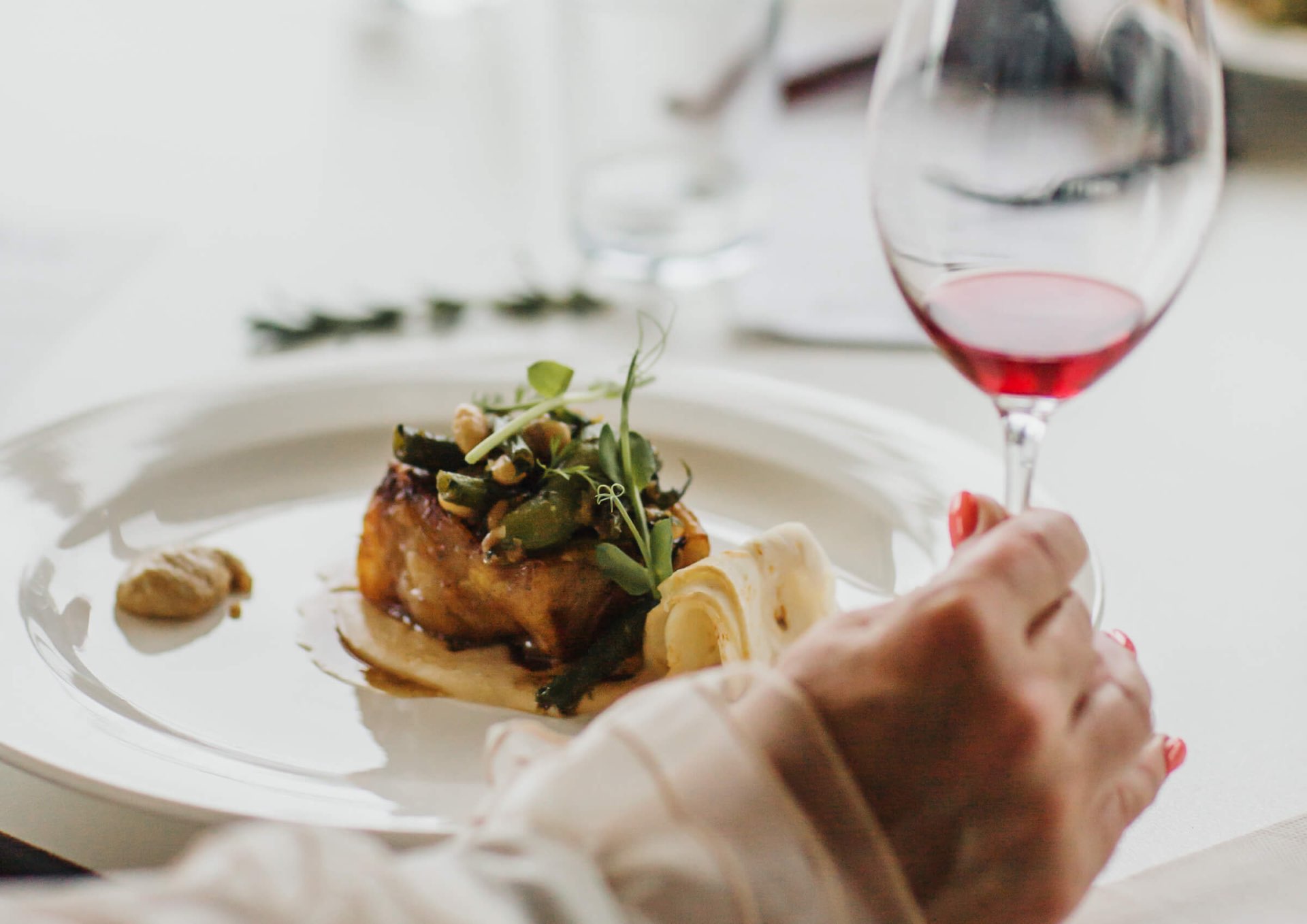 Rock climbers scaling cliff face with spectacular valley views below